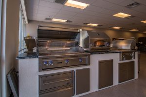 Custom Outdoor Kitchen with Lynx Barbecue Grill, Pizza Oven, Power Burner, Warming Drawer and Access Door & Drawers